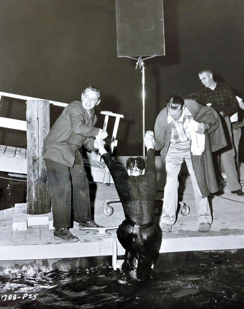 1955. 'Female on the Beach' set. Director Joseph Pevney at left.