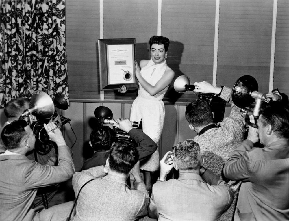 1955. Receiving the Golden Shutter Award from the LA Press Photographers Assoc.