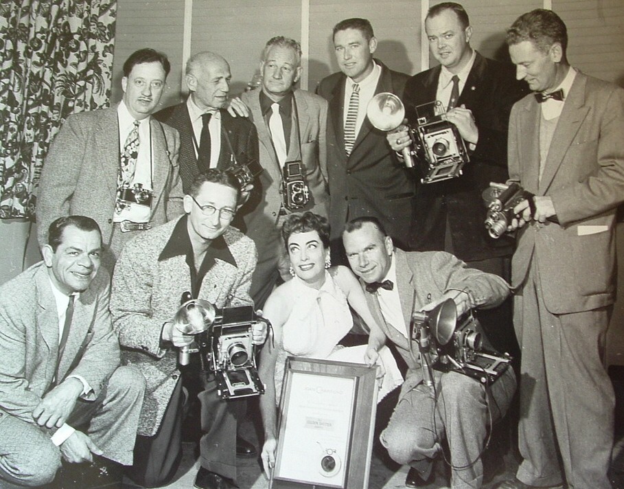 1955. Receiving the Golden Shutter Award from the LA Press Photographers' Association.