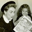 November 1955. Two candids reading to kids at the Southside Day Care Center in St. Louis, Missouri.