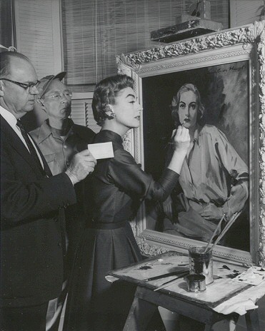 1955. Joan with the Haupt painting on the 'Queen Bee' set.