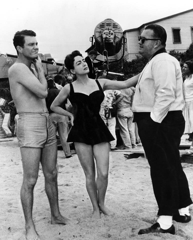 1956. On the set of 'Autumn Leaves' with Cliff Robertson and director Robert Aldrich. (Thanks to Crystal.)