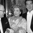 10/29/56. At Royal Film Performance event with husband Al Steele and Victor Mature.