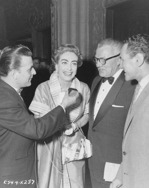 1957. With husband Al Steele at unknown event. (Thanks to Bryan Johnson.)