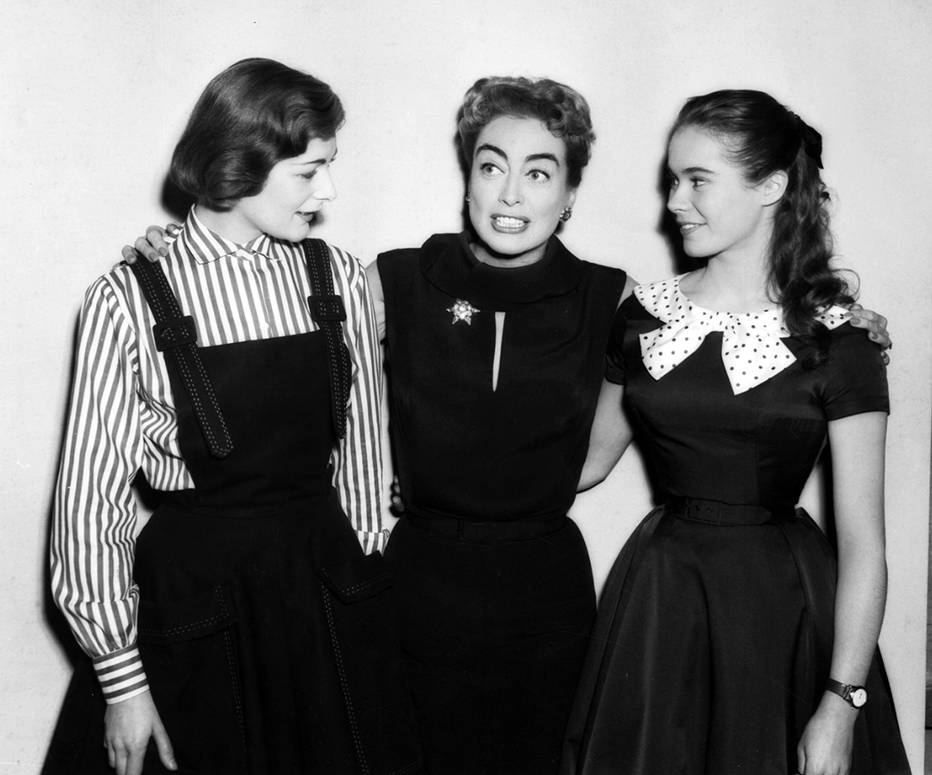 1957. On the set of 'Esther Costello' with Heather Sears, right, and Sears' sister. (Thanks to Vincent.)