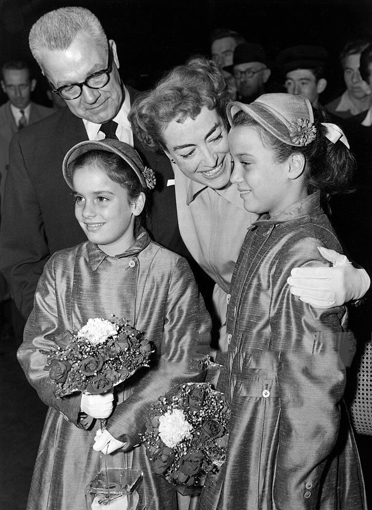 August 1956 at London's train station with Al Steele and the twins.