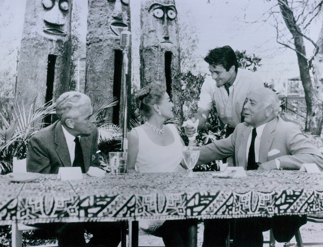 1959. At a 20th Century-Fox party with, left to right, producer Buddy Adler, actor Stuart Whitman, Fox president Spyros Skouras. Shot by Eve Arnold.