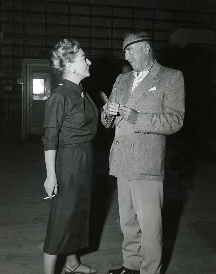 Director Raoul Walsh visits the 'Best of Everything' set.