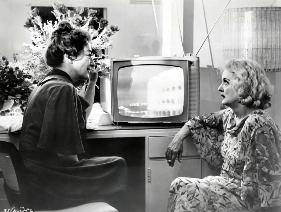 1962. On the set of 'Baby Jane' with Bette Davis.