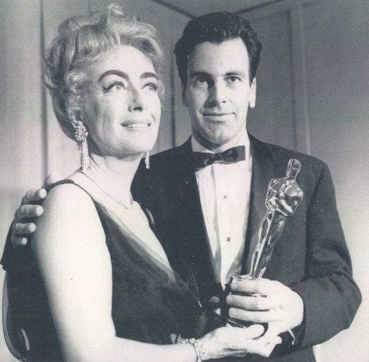 April 9, 1962. Joan presents Maximilian Schell with the Best Actor Oscar.