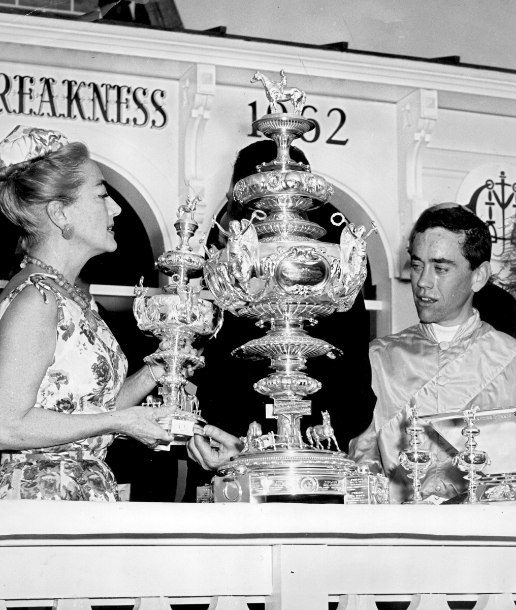 May 1962. Presenting jockey John Rotz with the Preakness trophy for Greek Money's win.