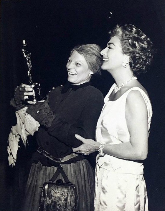 May 1963. Presenting Anne Bancroft with her Oscar on the set of 'Mother Courage and Her Children.'