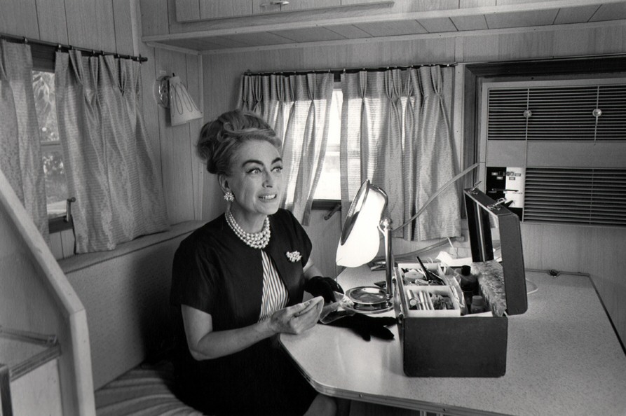 1964. In her trailer on the set of 'Hush...Hush Sweet Charlotte.' Photo by Flip Schulke.