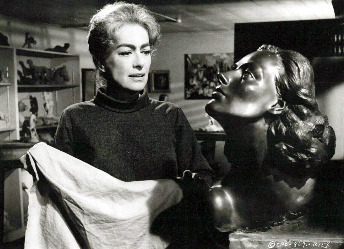 1964. 'Strait-Jacket.' With 'Woman's Face' sculpture by Yucca Salamunich.