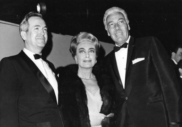4/15/65. At an Oscar after-party with Cesar Romero, right.
