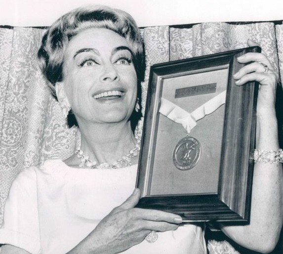 3/2/65. Receiving the NYC USO's 'Woman of the Year' award.