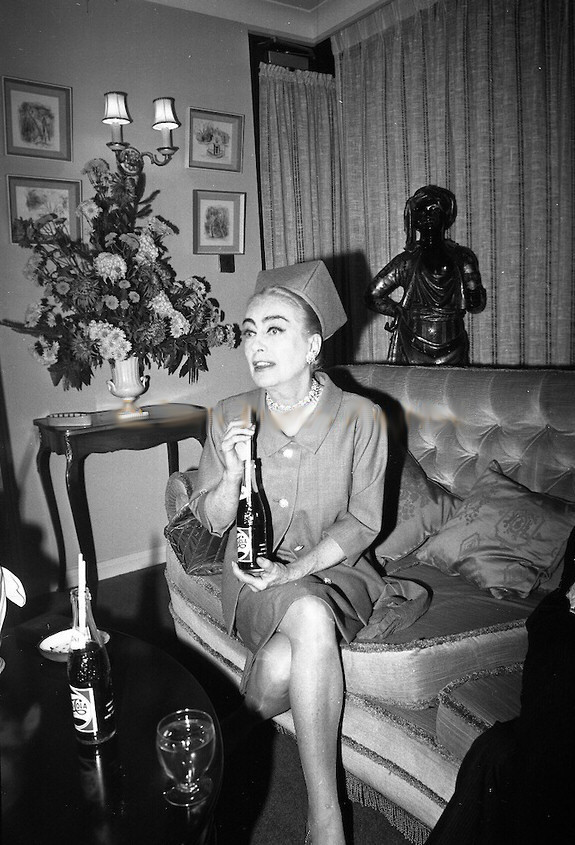 December 14, 1966, at Dublin's Gresham Hotel. Press photo caption: Joan Crawford Press Conference at the Gresham Hotel. Joan Crawford, a director of Pepsi Cola, is in Dublin with Mr. Len Leech, the company's Vice-President for the Northern European Division, for meetings with Pepsi's bottlers in Ireland to discuss new plans for expansion in 1967.
