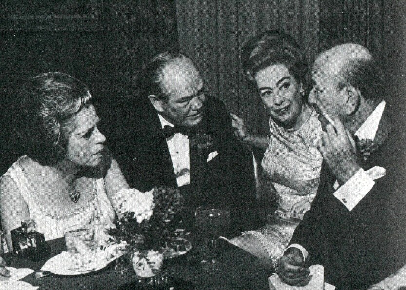 February 1970. Joan throws a party for Noel Coward (far right) at '21.' (Thanks to James Bruce for the photo.)