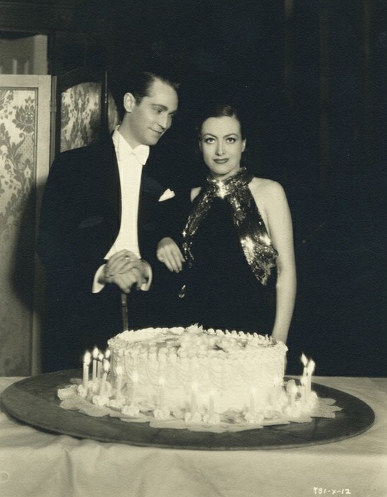 1934. On the set of 'Sadie McKee' with husband Franchot Tone.