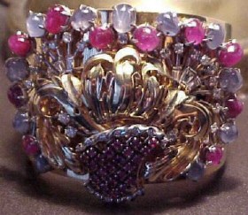 Bracelet of 14k gold, platinum, star sapphires, star rubies, diamonds.