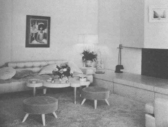 View of the fireplace from the bed, with Margaret Keane portrait to the left.