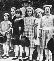 I found 
this photo years ago online. The site claimed that the tall girl in the 
back was Joan. 1918.