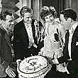 Joan celebrates her birthday on the set of 'Our Modern Maidens.' With director Jack Conway, husband Doug, co-star Rod LaRocque.