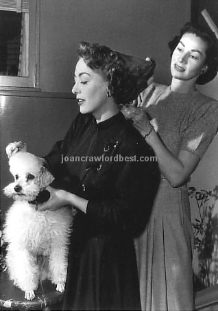 1950. On the set of 'The Damned Don't Cry.'
