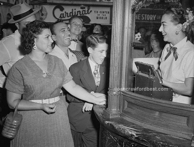 August 7, 1952. Joan takes tickets at the 'Sudden Fear' premiere.