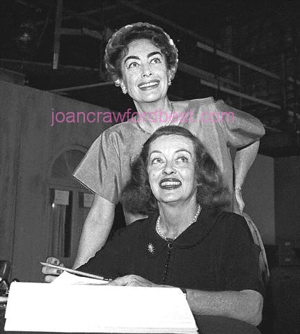 1962. Signing contracts for 'Baby Jane.'