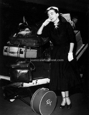 8/2/52. Joan and luggage at Grand Central Station.