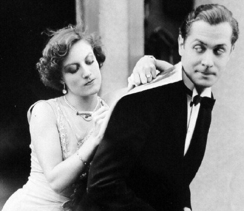 1929. With Robert Montgomery on the set of 'Untamed.'