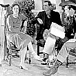 Joan with sprained ankle on the set of 'Montana Moon.' With director Malcolm St. Clair and Johnny Mack Brown.