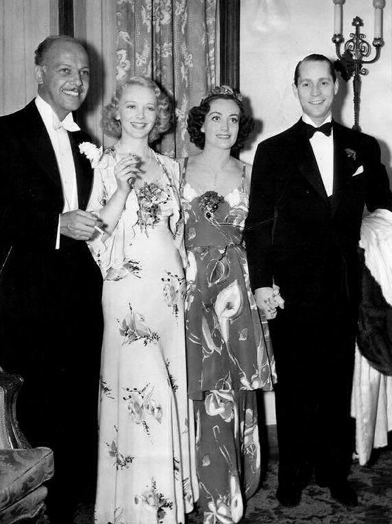 April 19, 1936, at the Beverly Wilshire Mayfair Ball with Mitchell Leisen, Virginia Bruce, and Franchot Tone.