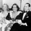 April 19, 1936, at the Beverly Wilshire Mayfair Ball with Mitchell Leisen, Virginia Bruce, and Franchot Tone.