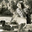 1936 at home with dachshunds.