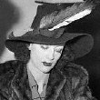 March 1939. Joan signs divorce papers to dissolve her marriage to Franchot Tone.