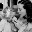 1936. On the set of 'Gorgeous Hussy' with niece Joan LeSueur.