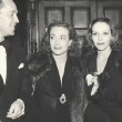 1937. With Franchot Tone, left, and Sally Blane.