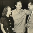 1938. On the set of 'The Shining Hour' with cameraman George Folsey, Robert Young, and director Frank Borzage.