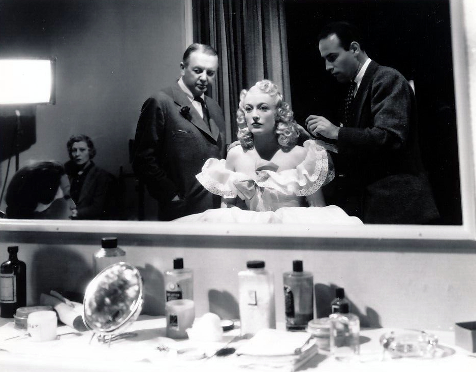 1939. On the set of 'Ice Follies' with director Schunzel and stylist Guilaroff.