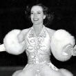 Skating on the set of 'Ice Follies,' with press caption.