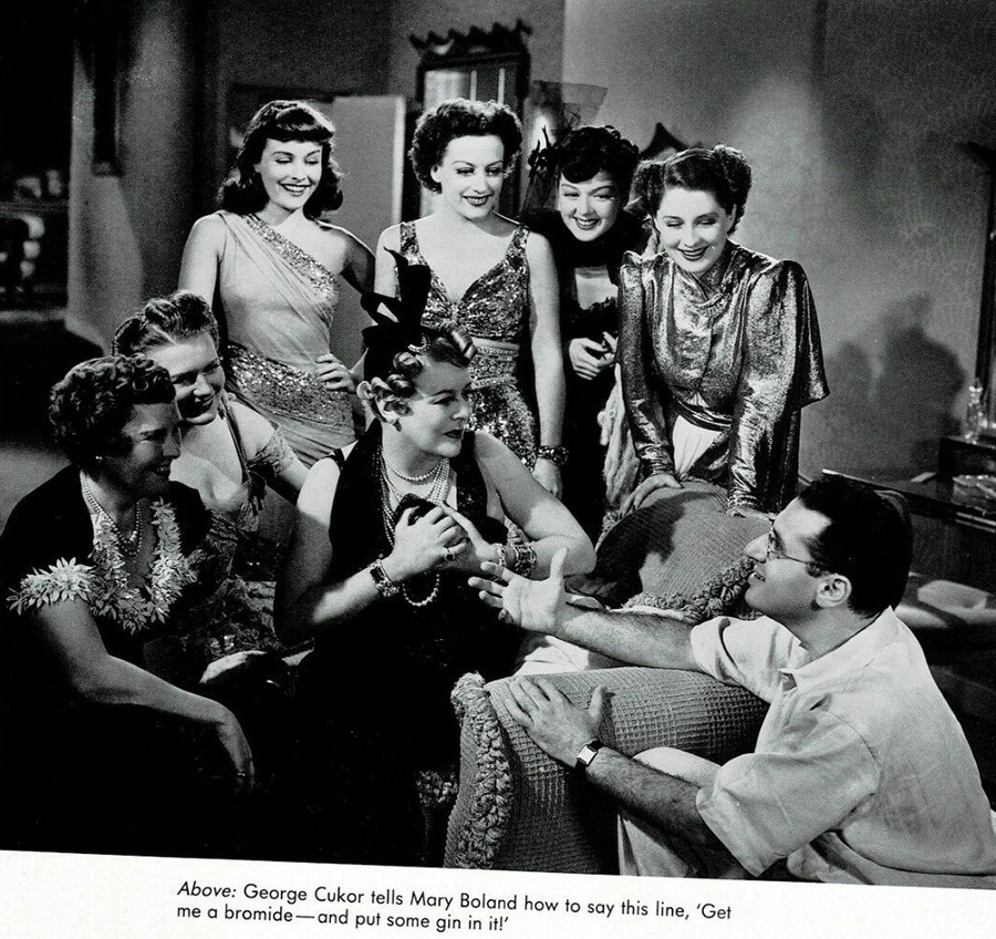 1939. On the set of 'The Women' with cast and director George Cukor.