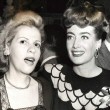 1945. Warners reception for Joan at NYC's Sherry-Netherland hotel, with Radie Harris.