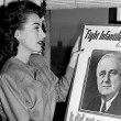 1945. With a March of Dimes poster featuring Pres. Roosevelt.