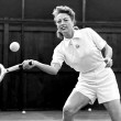 Circa 1945. Playing tennis.