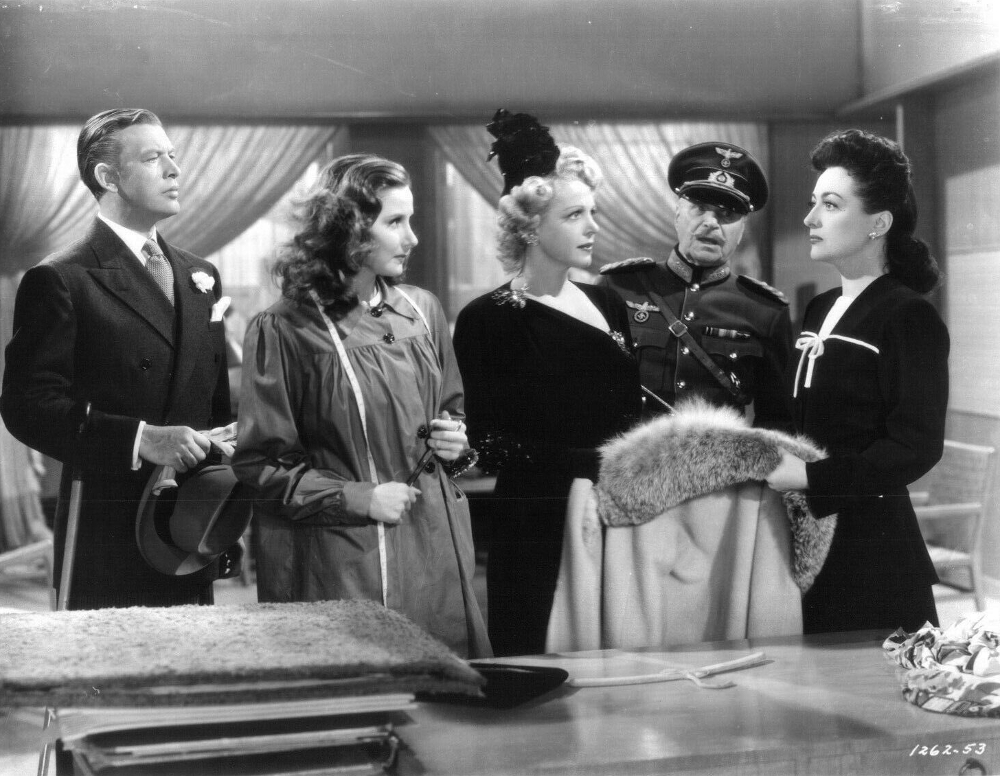 1942. 'Reunion in France.' With Philip Dorn, Natalie Schafer, and Albert Bassermann.