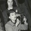 1943. On the set of 'Above Suspicion' with hairdresser Gertrude Kuhn.