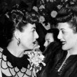 1945. At a Warners reception for Joan at NYC's Sherry-Netherland. With the Andrews Sisters.