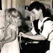 1943. Joan and Tina at home.